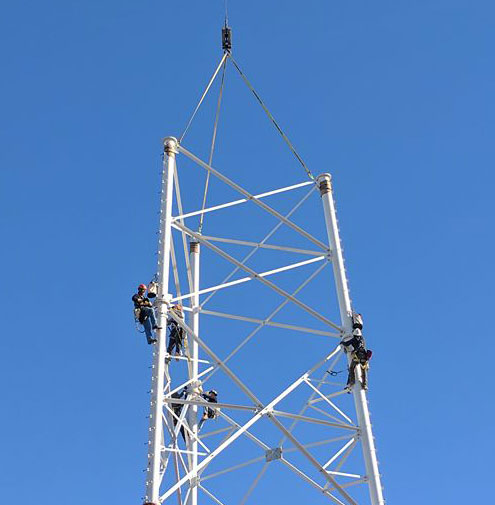 Working men on high pole